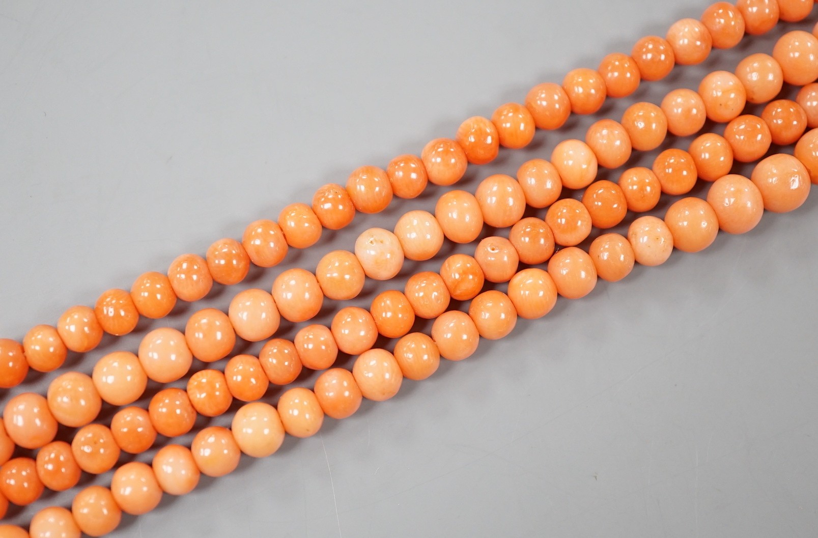 Two single strand coral bead necklaces, one a.f., longest 103cm.